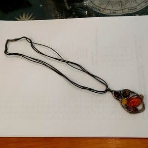 Pendant necklace with leather and amber